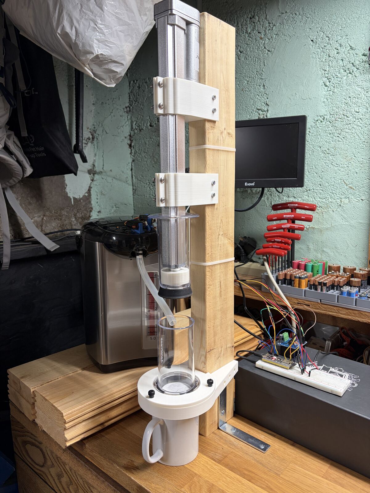 The Phase 2 press rig — plunger and coupler over the AeroPress chamber, fed by the Tiger dispenser