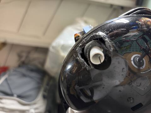 Dremel-relieved spout housing close-up