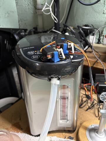 Servo bracket on the Tiger's panel with dispense tube