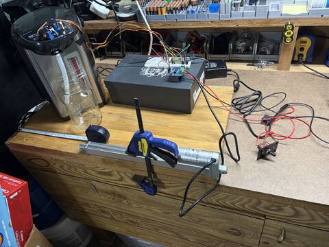 Linear actuator clamped to the bench for bring-up