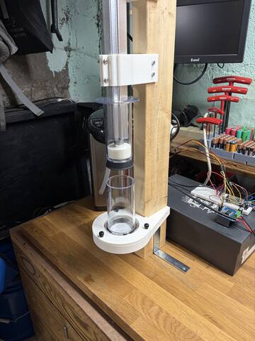 Plunger descending the bore during a dry press