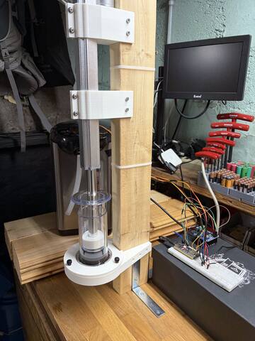Plunger homed above the chamber mouth during the wet session